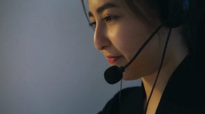 Woman at work wearing her headset.